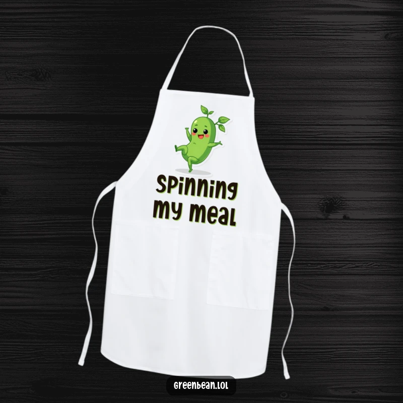 Funny apron featuring a cheerful green bean doing a cartwheel with leafy tops trailing, kitchen humor.