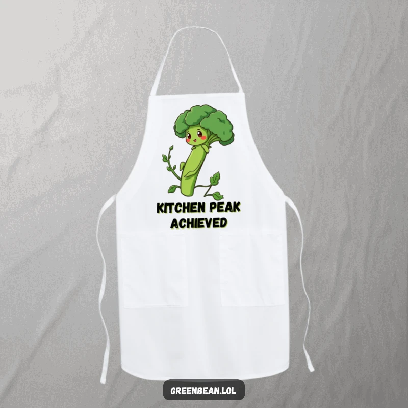 Funny Apron with a determined green bean character climbing a broccoli stalk, perfect for a motivated cook.