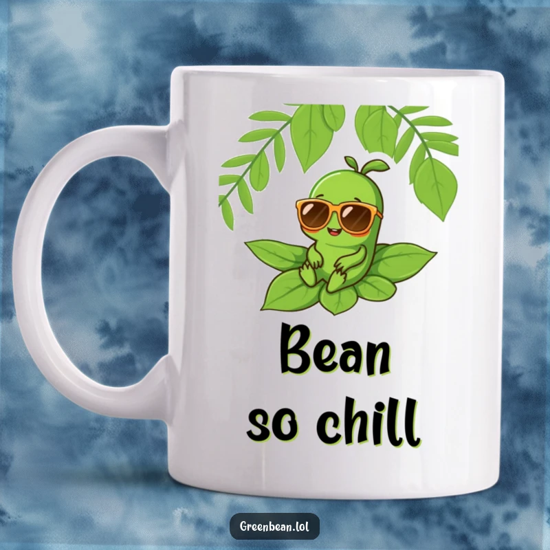 Funny mug of a cheerful green bean character wearing oversized sunglasses, lounging coolly on a large green leaf, embodying relaxation.