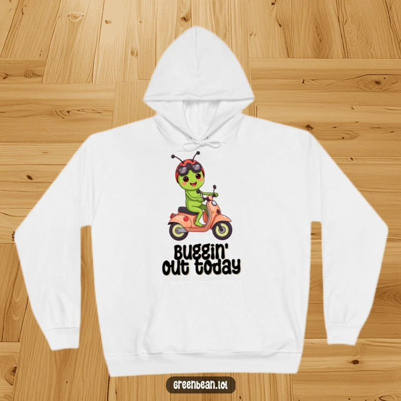 Funny hoodie depicting a happy green bean character cruising on a ladybug styled as a scooter.