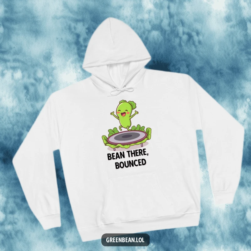 Funny hoodie featuring an enthusiastic green bean character having a blast bouncing high on a lettuce trampoline.