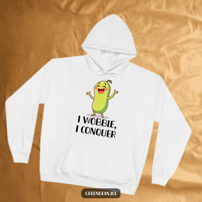 Funny green bean hoodie showing a laughing character doing a funny wobble dance, offering warmth and hilarious veggie-themed amusement. Soft and cozy.