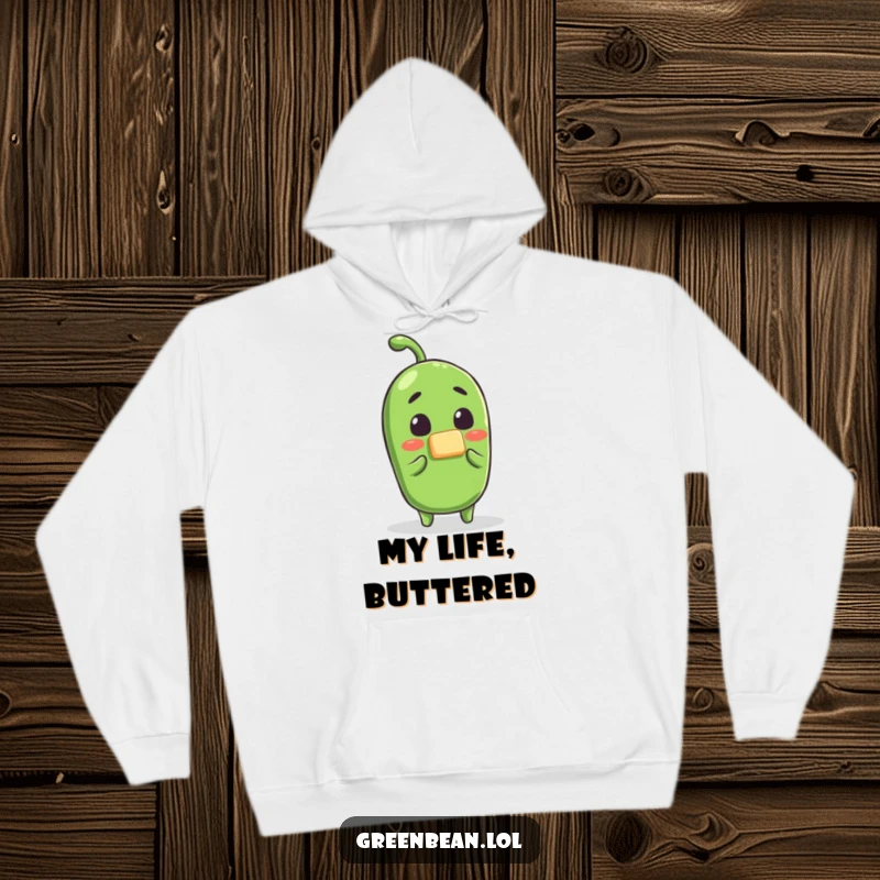 Funny green bean butter surprise hoodie, a shocked bean character receiving butter, soft and humorous apparel for chilly days, great funny gift.