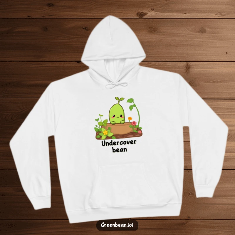 Funny hoodie with a curious green bean character peeking out from a garden bed. Comfortable and humorous garden-themed apparel.