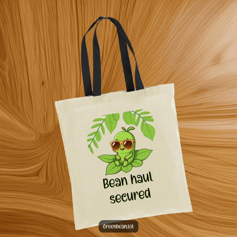 Funny tote bag showing a green bean character with oversized sunglasses relaxing on a leaf, perfect for carrying daily items.