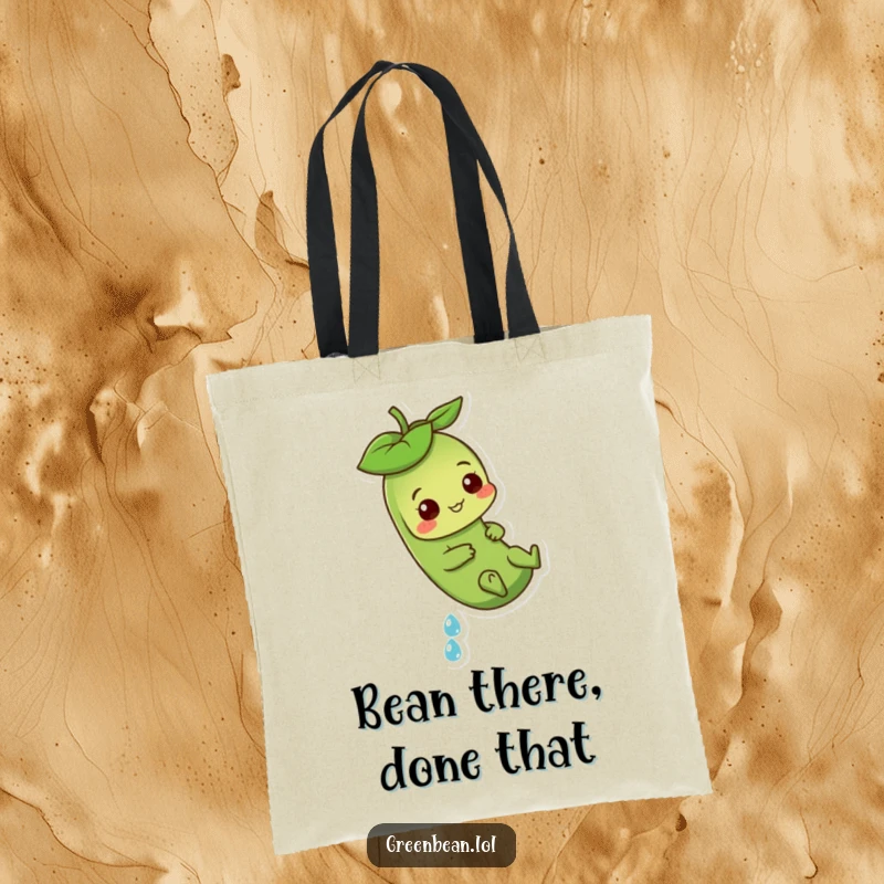Funny Green Bean Tote Bag with a playful character sliding down a dewdrop, perfect for carrying essentials with style.