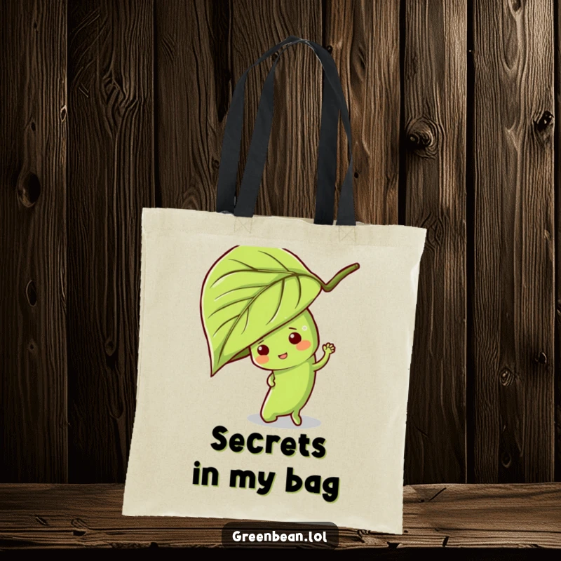 Funny green bean tote bag featuring a mischievous character peeking from behind a leaf, perfect for stylishly carrying essentials.